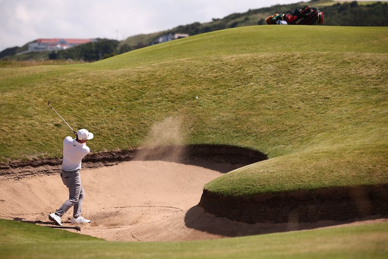 US golfer Collin Morikawa plays from a bunker onto the 14th green during a practice round at Royal Portrush on Wednesday. Photograph: Henry Nicholls/AFP via Getty Images        