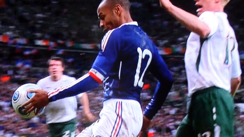 Henry keeps the ball in with his hand on the way to William Gallas scoring to knock Ireland out. Photo: Sky Sports