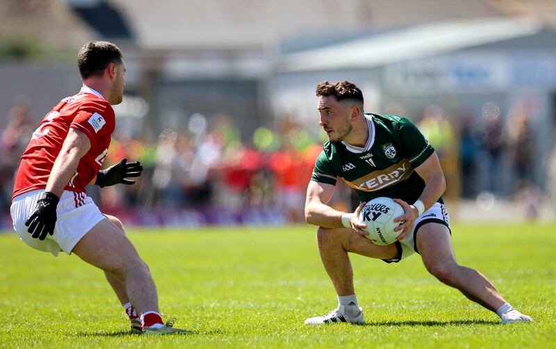 Kerry’s Paudie Clifford comes up against Cork's Maurice Shanley. Photograph: Ryan Byrne/Inpho