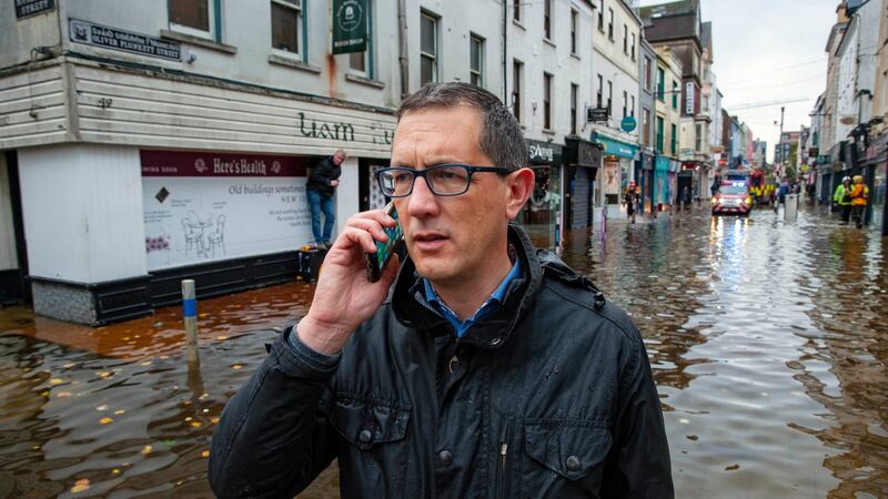 Conor Healy, chief executive of Cork Chamber surveys the level of flooding on Oliver Plunkett Street, Cork city. Photograph: Daragh Mc Sweeney/Provision