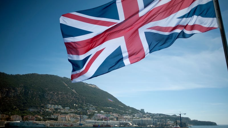 Union jack flutters from a vessel sailing by Rock of Gibraltar. Photograph:  Jorge Guerrero/AFP/Getty Images