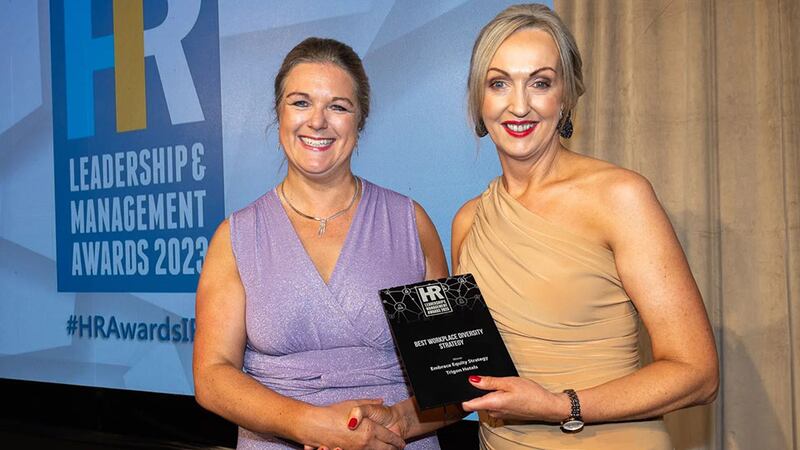 Rosarii Mannion, awards judge, presents the best workplace diversity strategy award to Kathleen Linehan, Trigon Hotels