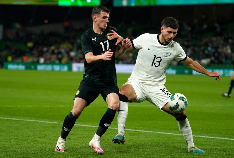 Republic of Ireland's Jason Knight and New Zealand's Libby Cacace. Photograph: Niall Carson/PA Wire