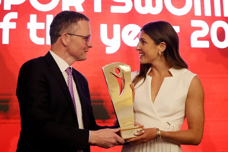 Minister for Sport Patrick O’Donovan presents Kate O'Connor with the Sportswoman of the Year award. Photograph: Alan Betson