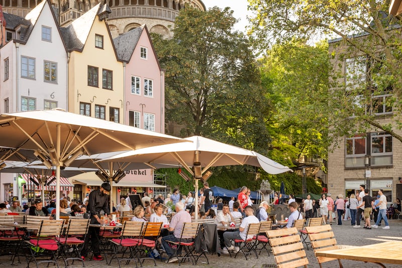 Casual dining and cafe culture: Enjoy a lively buzz at historic Fischmarkt (fish market) square in Cologne. Photograph: Dagmar Schwelle/GNTB