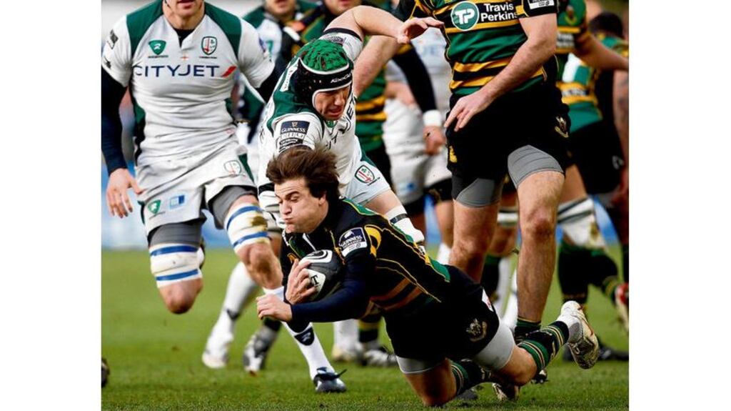 London Irish's Bob Casey tackles Northampton's Lee Dickson during their Premiership match at Franklin's Gardens, Northampton on Saturday. Northampton won the match 24-22.