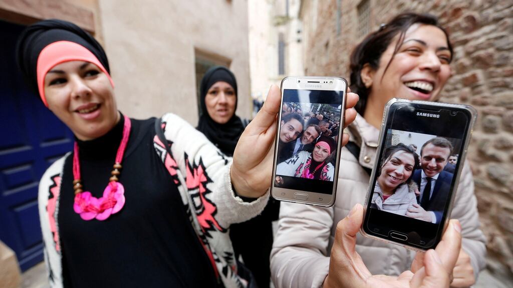 Supporters show their selfies with Emmanuel Macronduring a campaign visit in Rodez, France, on Friday. Photograph: Reuters/Regis Duvignau