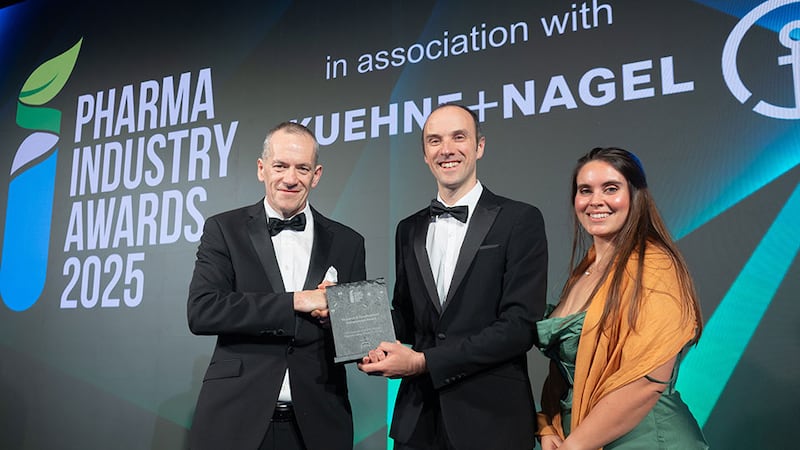 Pat Browne, head of fixed sales at OBW Technologies, presents the research and development achievement award to Niall O'Reilly and Tess Ames, Pharmaceutical and Molecular Biotechnology Research Centre