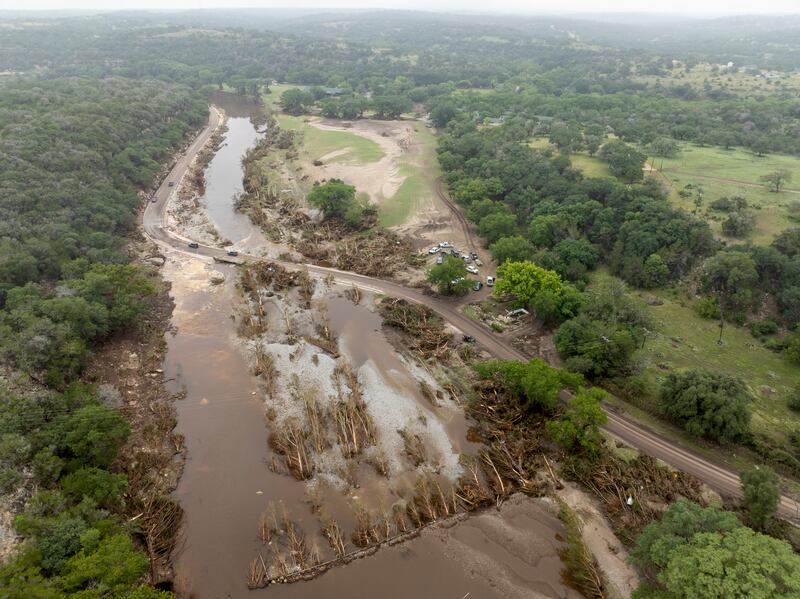 The flooded Guadalupe River in Hunt, Texas, near the site of Camp Mystic. Photograph: Carter Johnston/The New York Times
                      