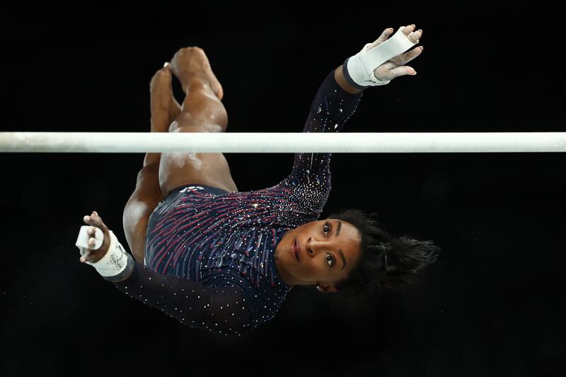Simone Biles on the uneven bars in training. Photograph: Naomi Baker/Getty Images