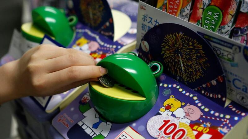 Office snack piggy bank:  invention of confectionery maker Ezaki Glico. Photograph: Yuya Shino/Reuters