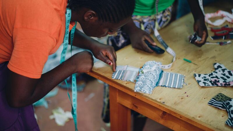 Making reusable sanitary pads from leftover material in the Stitching Academy, founded by Soko Kenya. Photograph: Fionn McCann