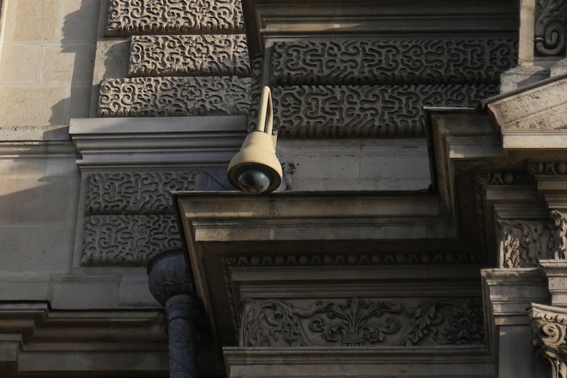 A surveillance camera on a facade of the Louvre museum in Paris. Photograph: Thibault Camus/AP