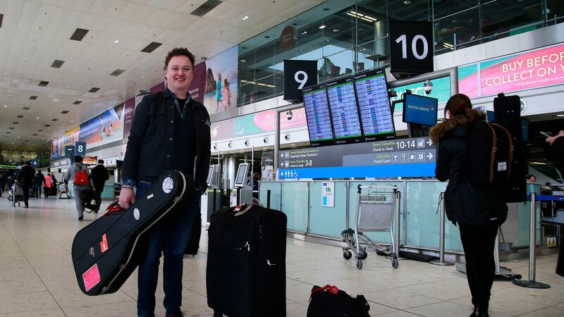 Musician ‘Mundy’ heading off on a tour at the airport. Photograph: Nick Bradshaw