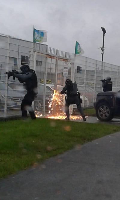 The Criminal Assets Bureau (Cab) with the assistance of Garda teams conducting a search operation on the Limerick garage in March 2019. Photograph: Cab/Facebook