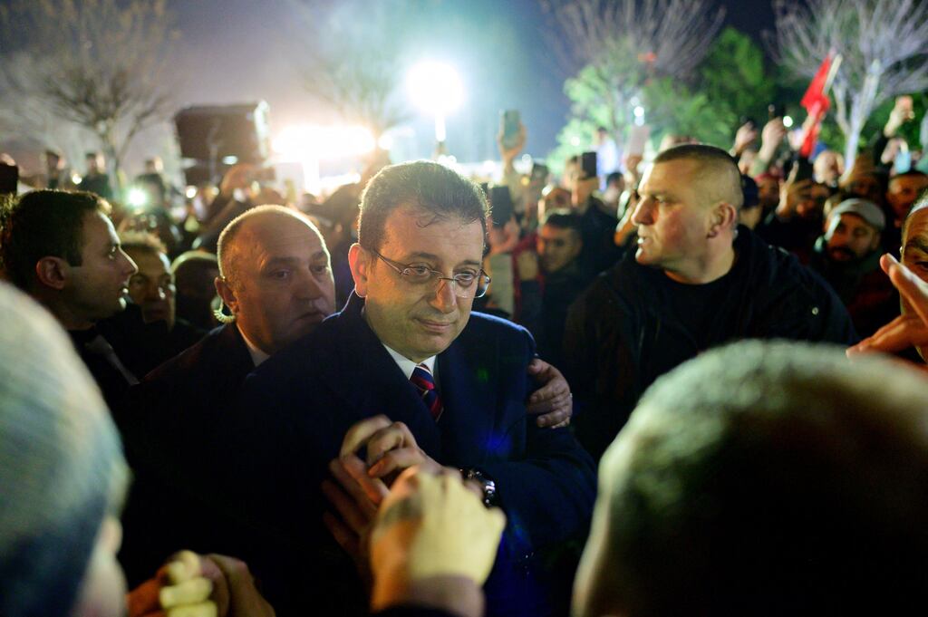 Istanbul mayor Ekrem İmamoğlu, centre, joins his supporters after his sentencing. Photograph: Yasin Akgul/ AFP via Getty