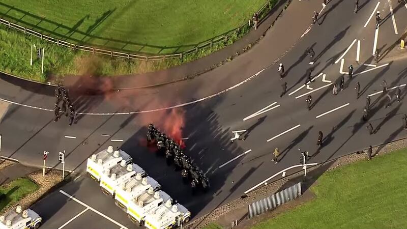 At the Sandyknowes roundabout in Newtownabbey on the outskirts of Belfast, about 200 protesters are clashing with police dressed in riot gear. Photograph: Sky News helicopter footage.