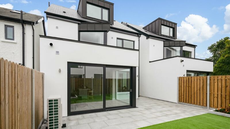 Back garden  is accessed through large sliding doors. It is laid out in artificial lawn and has a northern aspect and a side entrance