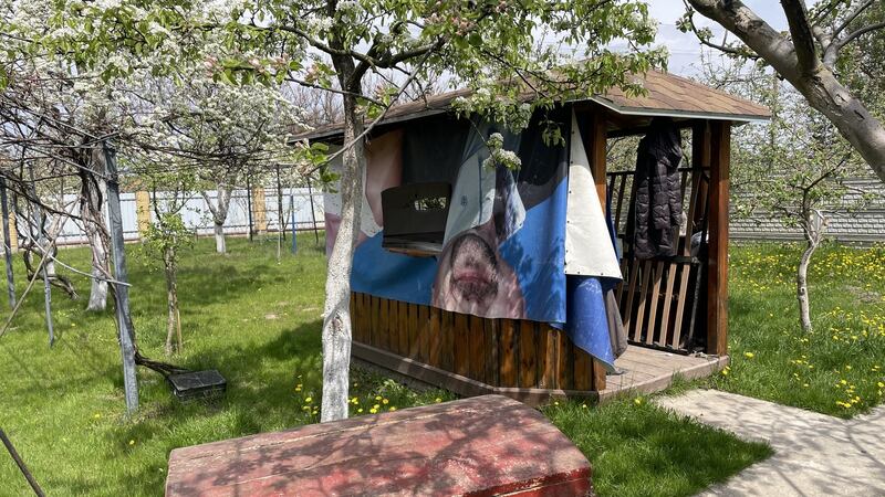 Russian soldiers in the Ukrainian village of Kopyliv made local man Serhiy Pohorelov sit in a wooden chest in the garden of the house they commandeered as a field hospital so that any artillery fire ‘would kill him first’. Photograph: Daniel McLaughlin
