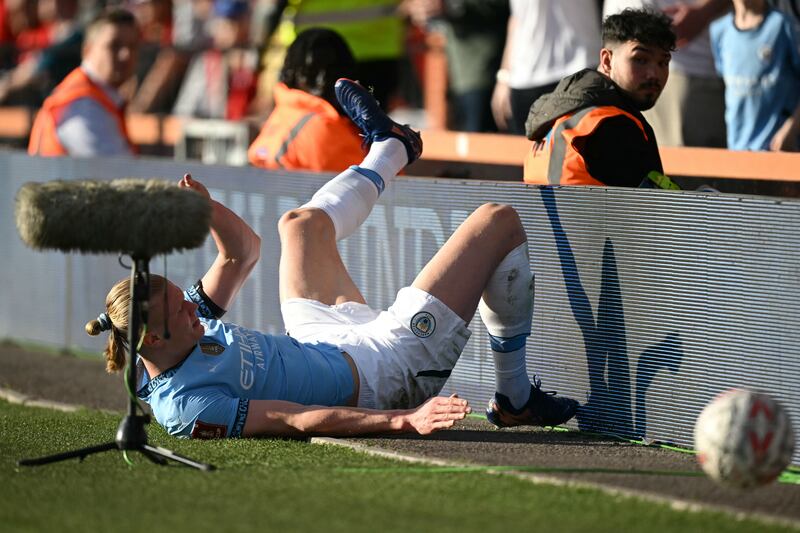 Manchester City's Erling Haaland reacts after a challenge with Bournemouth's Lewis Cook. Photograph: Getty Images