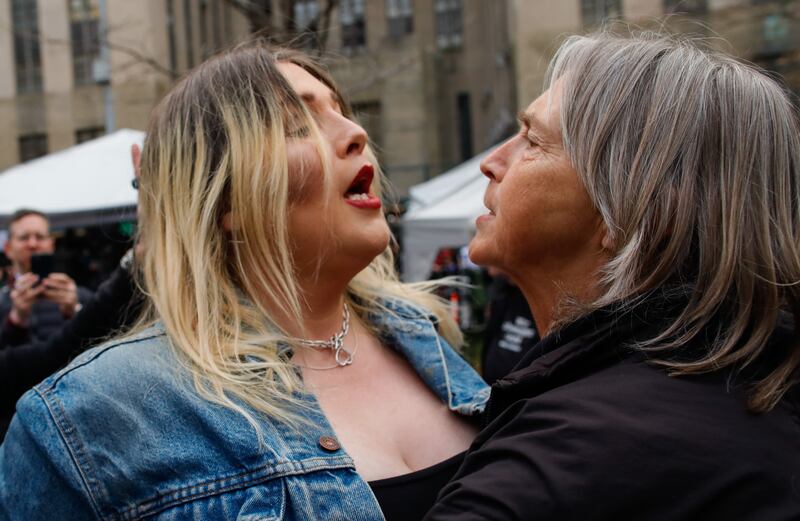 A Donald Trump supporter  argues with an anti-Trump protester outside the Manhattan Criminal Courthouse. Photograph: Kena Betancur/Getty Images