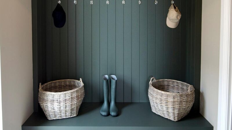 As well as a utility room there is a boot room painted in the same deep, pigmented colours.