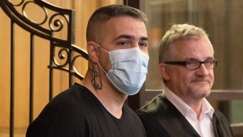 Plaintiff Anis Mohamed Youssef Ferchichi (left), known as German rapper Bushido, next to his lawyer as he waits at a courtroom for the continuation of a trial against the head of a clan of Arabic origin. Photograph: Getty
