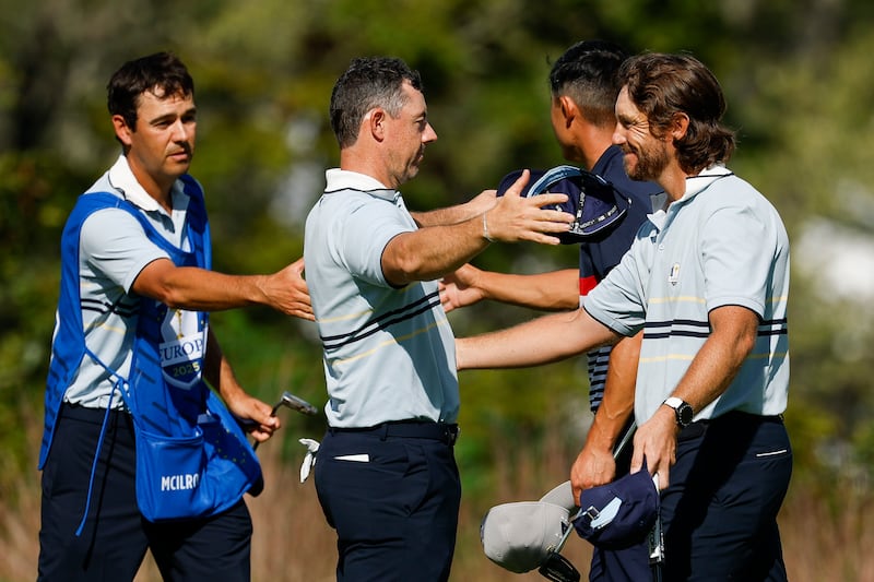 Tommy Fleetwood and Rory McIlroy of Team Europe embrace. Photograph: Harry How/Getty