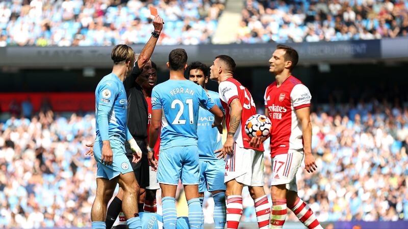 Referee Martin Atkinson sends off  Granit Xhaka at the  Etihad Stadium. Photograph: Catherine Ivill/Getty Images