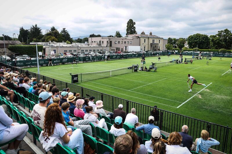 Thanasi Kokkinakis serves to Ammar Elamin during their match at Elm Park. Photograph: Tom Maher/Inpho