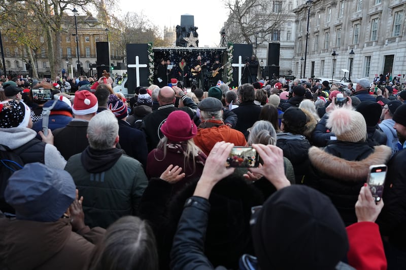 A band playing during a Christmas carol service in Whitehall, London organised by Tommy Robinson's Unite the Kingdom movement. Picture date: Saturday December 13, 2025. PA Photo. Photo credit should read: Jonathan Brady/PA Wire