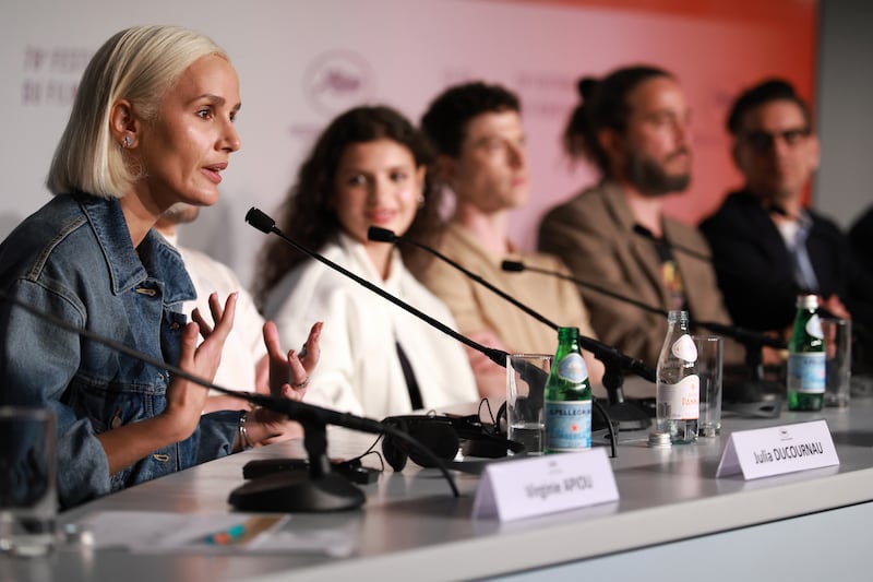 Julia Ducournau speaks on stage during a press conference promoting Alpha at the Cannes Film Festival. Photograph: Clemens Bilan/Pool/Getty