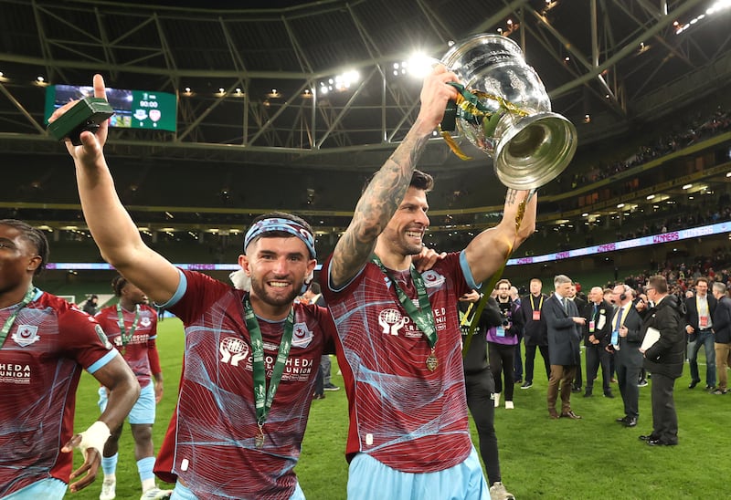 Drogheda United's Luke Heeney and Adam Foley celebrate winning the 2024 FAI Cup Final at the Aviva Stadium. Photograph: Bryan Keane/Inpho