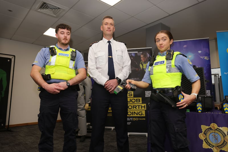 Garda Commissioner Justin Kelly (centre) with Garda Daniel Molloy and Garda Kelly Smyth carrying Tasers. Photograph: Alan Betson
