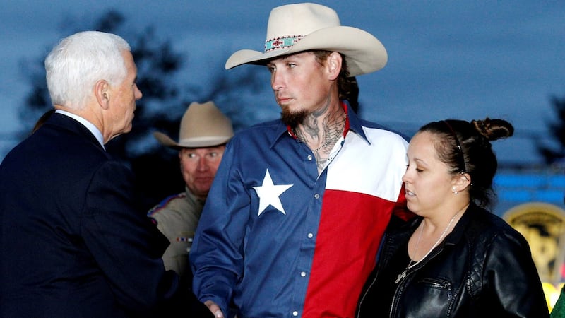 US vice president Mike Pence shakes hands with Johnnie Langendorff, who  chased the assailant, near the site of the shooting at the First Baptist Church of Sutherland Springs in  Texas. Photograph:  Reuters/Jonathan Bachman