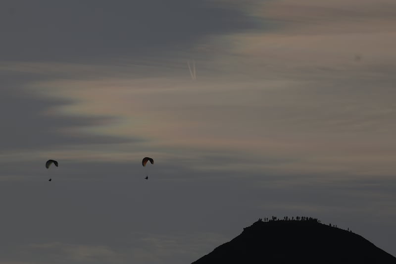 Handgliders and eclipse lookouts on the summit of the Sugerloaf in county Wicklow. Photograph: Nick Bradshaw