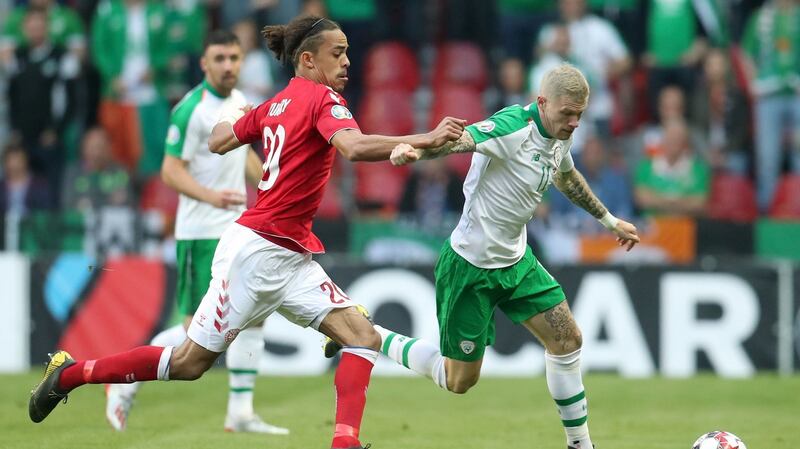 Yussuf Poulsen tackles McClean. Photo: Bradley Collyer/PA Wire