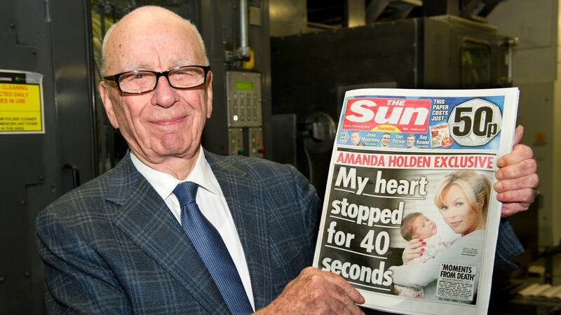 Rupert Murdoch reviews the first edition of The Sun On Sunday as it comes off the presses on February 25th, 2012 in Broxbourne, England.  Photograph: Arthur Edwards/News International via Getty Images