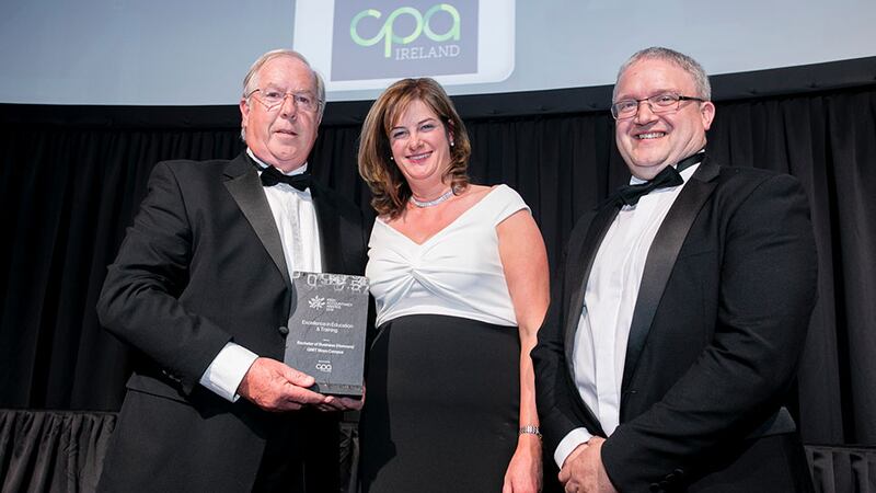 Gearóid O’Driscoll, President, CPA Ireland, presents the Excellence in Education & Training award to Caroline Clarke & Michael Gill, GMIT Mayo Campus.