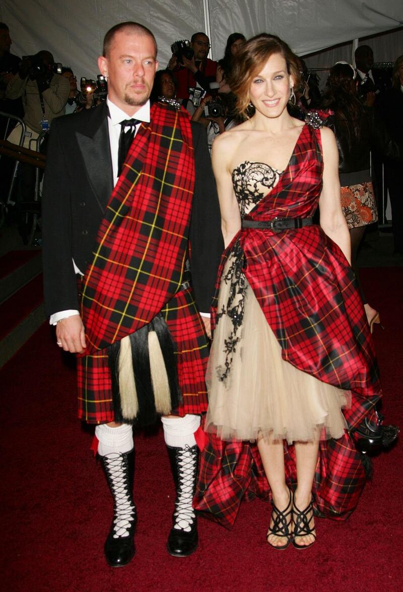 Sarah Jessica Parker, in a one-shoulder tartan design, arrives  with designer Alexander McQueen. Photograph: Evan Agostini/ Getty Images