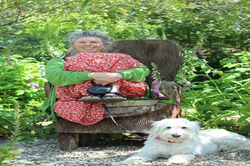 Mary Reynolds with her dog Lucky. Photograph: Claire Leadbitter