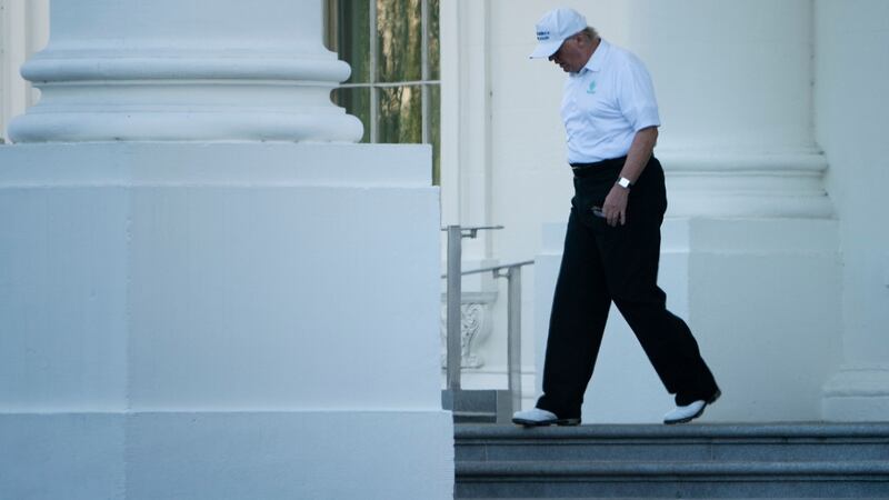 Trump walks from the White House to his motorcade before traveling to his Virginia golf club in 2017. Photo: Brendan Smialowski/AFP via Getty Images