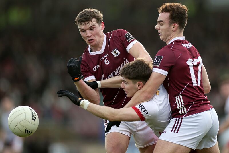 Tyrone's Niall Devlin with John Daly and Daniel O'Flaherty of Galway. Photograph: Laszlo Geczo/Inpho