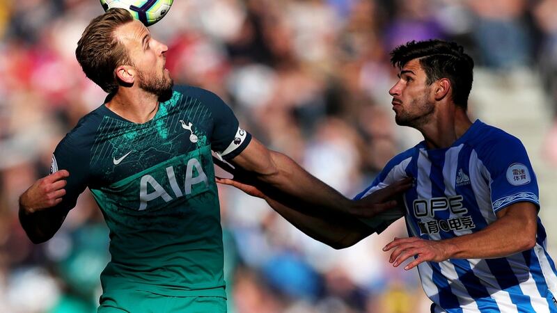 Harry Kane of Tottenham Hotspur heads the ball under pressure from Christopher Schindler. Photograph: Alex Morton/Getty Images