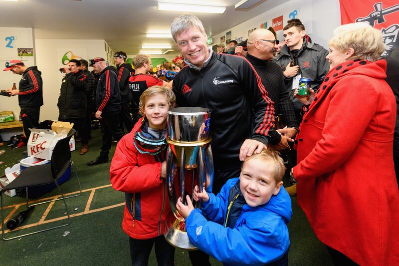 Ronan O'Gara and some of his children pose with the Super Rugby trophy won by Crusaders, where he was assistant coach, in 2019. Photograph: Kai Schwoerer/Getty Images