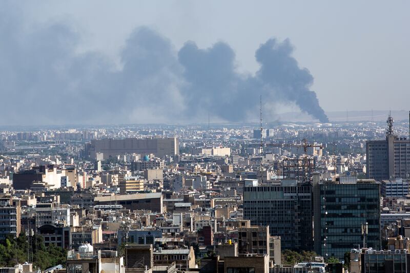 Smoke rises after an Israeli air strike in Tehran on Tuesday, June 17, 2025. Photograph: Arash Khamooshi/The New York Times
                      