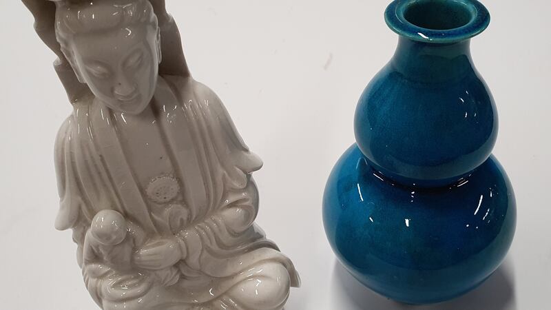 The 19th century oriental Blanc de Chine Quan Yin figure along with a blue Chinese double gourde vase (€100-€200,  Sean Eacrett).