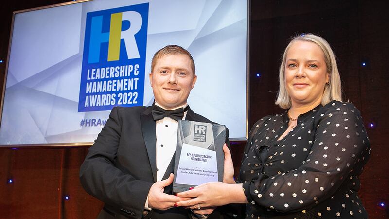 Kieran Ward, director, Employee Financial Wellness, presents the Best Public Sector HR Initiative award to Elaine McGrane, Tusla Child and Family Agency.