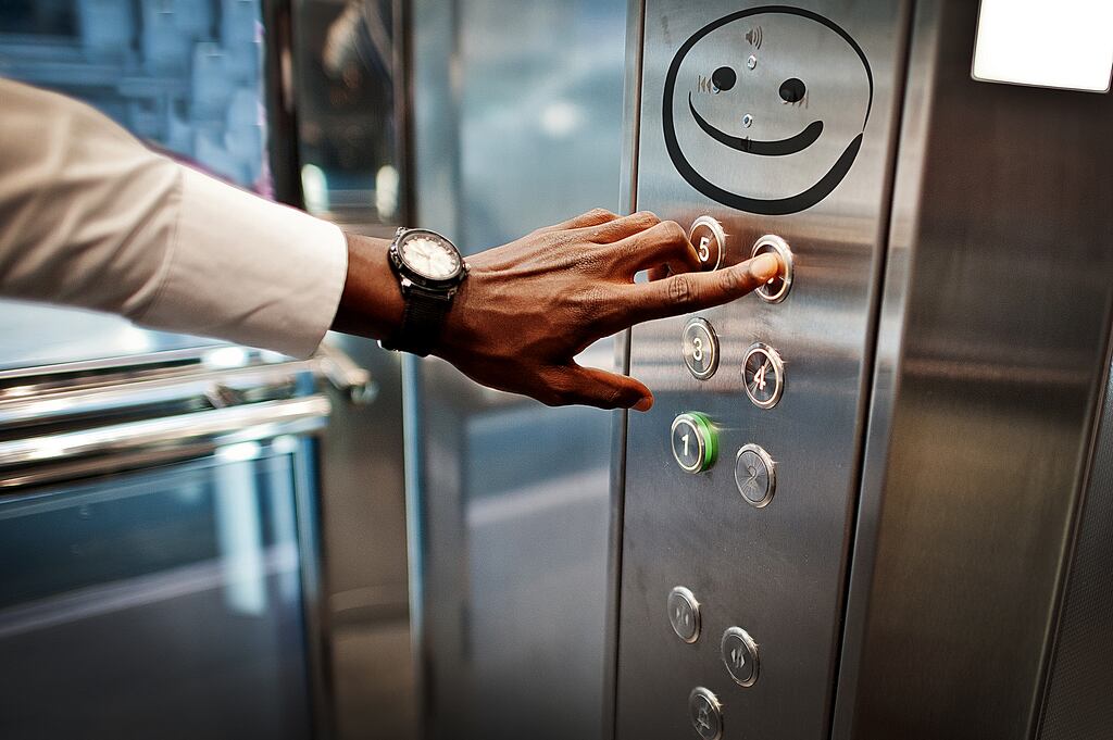 Someone has drawn two googly eyes in the hospital lift. When I see them I begin to laugh
