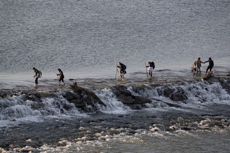 Migrants cross Meric river as they walk towards the Turkey’s Pazarkule border crossing with Greece’s Kastanies, near Edirne, Turkey on March 1st. Photograph:  Marko Djurica/Reuters